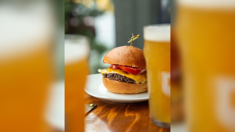 A cheeseburger and two glasses of lager at Loyal Legion in Portland, Oregon.