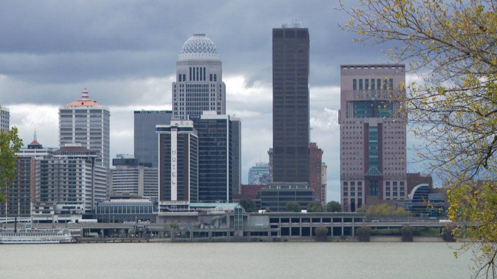 Tall buildings overlook a river. It's the skyline of Louisville, Kentucky, which overlooks the Ohio River.