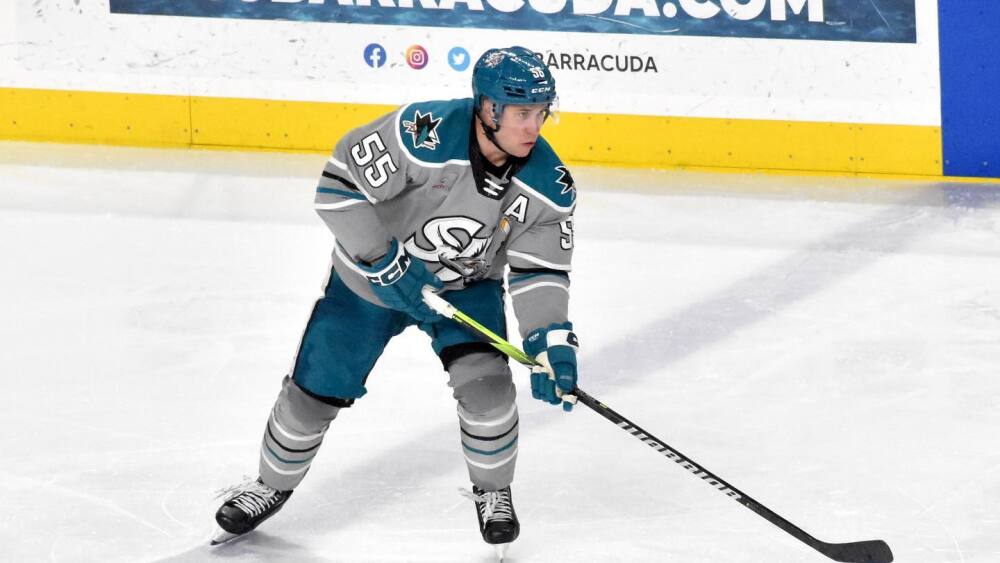 Derrick Pouliot handles the puck on the ice.