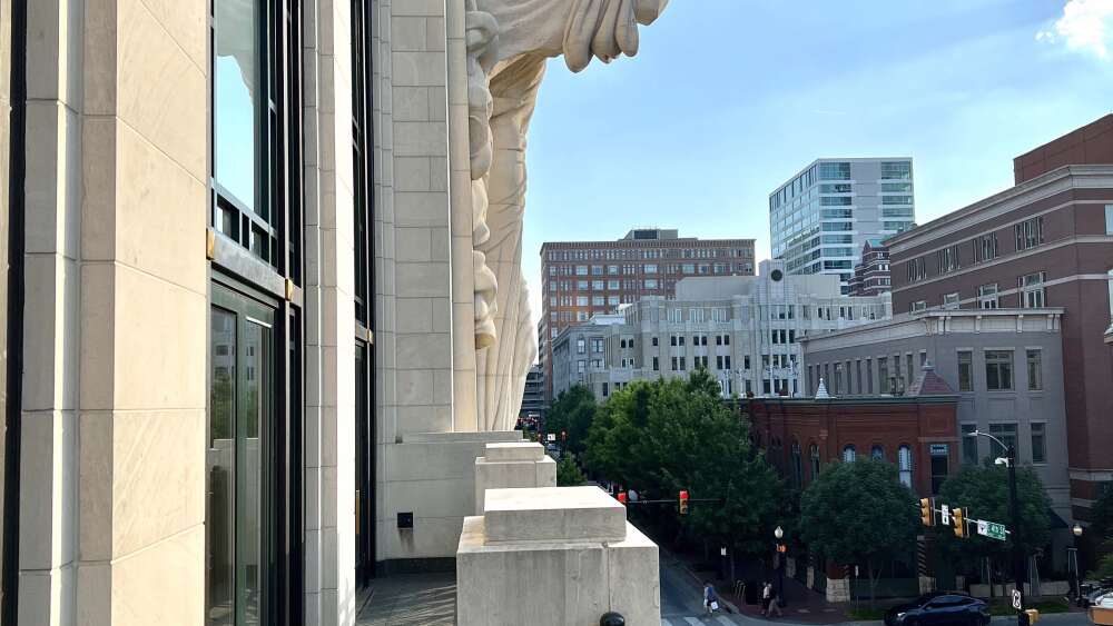 Photo of an angel sculpture at the end of a balcony