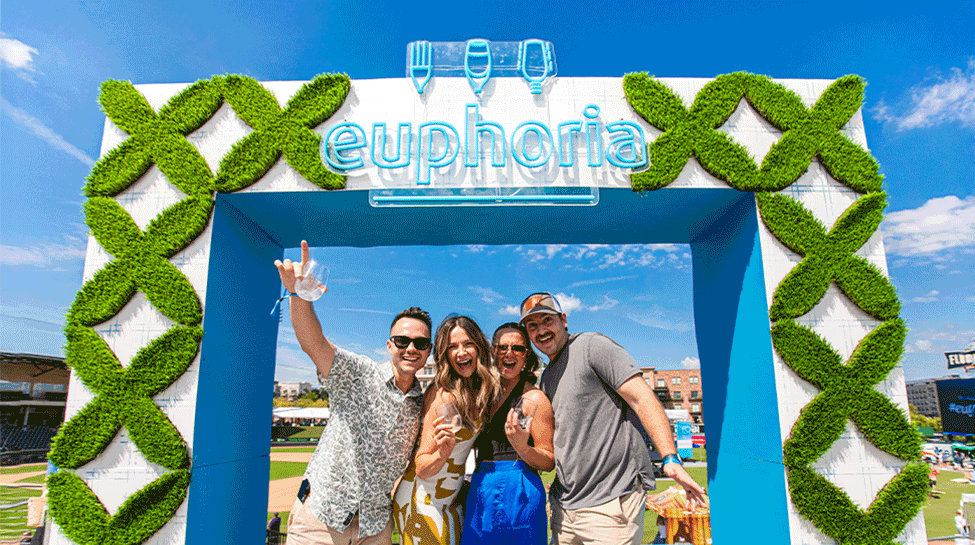 A GIF of people posing under a euphoria sign at euphoria in Greenville, SC.