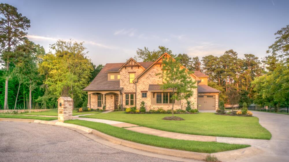 Exterior of a brick home at sunset.