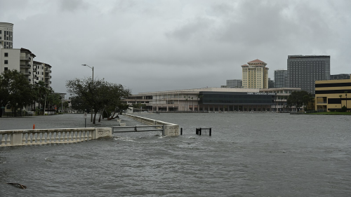 Storm surge floods Bayshore Boulevard. The Tampa Convention Center is in the background.