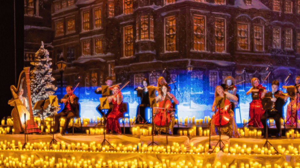 A series of images showcasing a musical performance on stage with thousands of glowing candles. People are wearing ballgowns singing and playing string instruments.