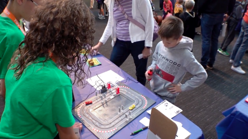 Boy testing a toy race track