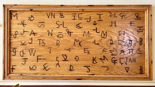 Photo of a wooden boards with brands.