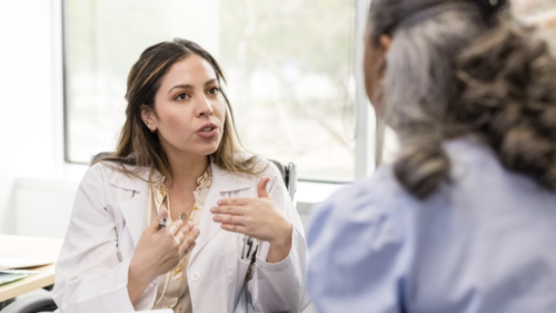 a female doctor speaks to a patient