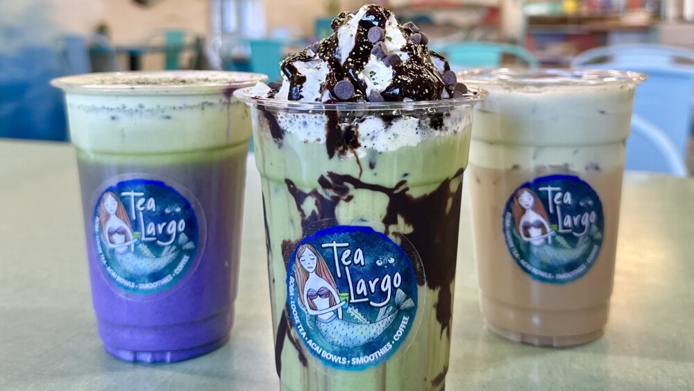 Three matcha lattes from Tea Largo in Lakeland: ube cupcake, chocolate mint with whipped cream, and Irish cream.